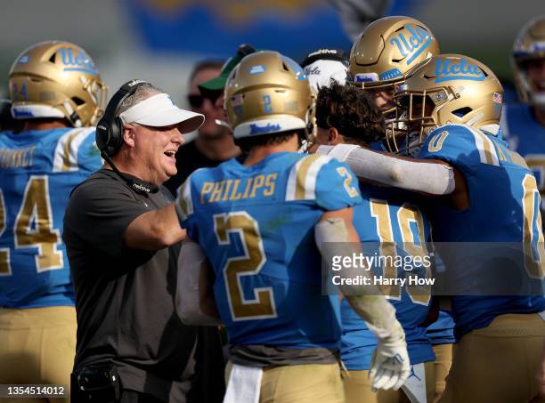 Head coach Chip Kelly of the UCLA Bruins celebrates a touchdown from Kazmeir Allen, to take a 21-10 lead over the USC Trojans, during the second...