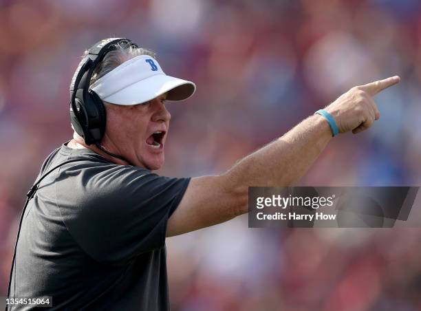 Head coach Chip Kelly of the UCLA Bruins argues a call receiving a unsportsmanlike conduct penalty during the first quarter against the USC Trojans...