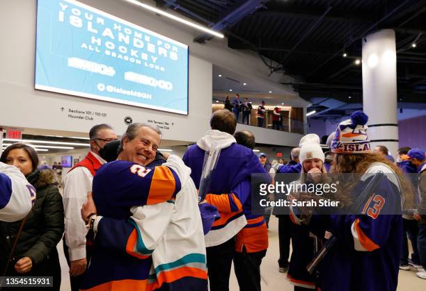 Fans enter the arena prior to the game between the Calgary Flames and the New York Islanders at UBS Arena on November 20, 2021 in Elmont, New York....