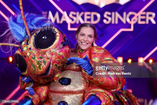 Sandy Moelling is revealed to be "Die Raupe" during the final show of the 5th season of "The Masked Singer" at MMC Studios on November 20, 2021 in...