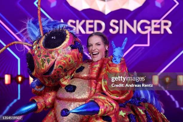 Sandy Moelling is revealed to be "Die Raupe" during the final show of the 5th season of "The Masked Singer" at MMC Studios on November 20, 2021 in...