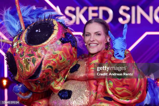 Sandy Moelling is revealed to be "Die Raupe" during the final show of the 5th season of "The Masked Singer" at MMC Studios on November 20, 2021 in...