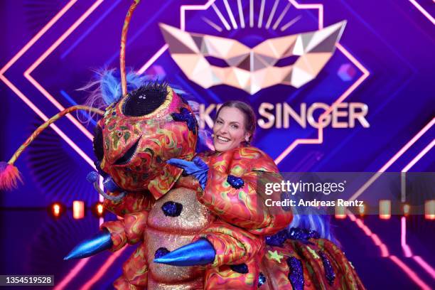 Sandy Moelling is revealed to be "Die Raupe" during the final show of the 5th season of "The Masked Singer" at MMC Studios on November 20, 2021 in...