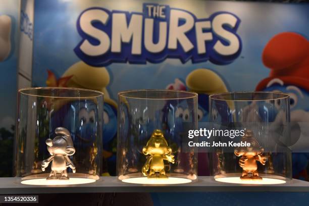 Gold, silver and bronze coloured Smurf model figures are displayed at the Smurfs stand during Brand Licensing Europe at ExCel on November 18, 2021 in...