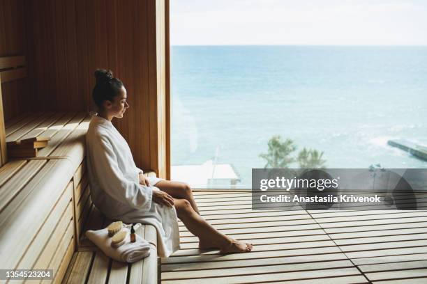 young beautiful slim woman relaxing in spa. - health spa stock pictures, royalty-free photos & images