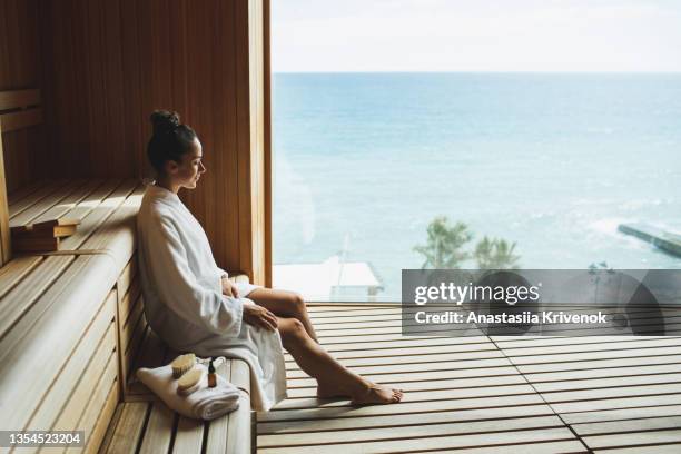 young beautiful slim woman relaxing in spa. - health spa imagens e fotografias de stock
