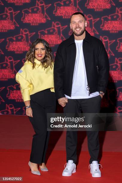 Ines Reg and Kevin Debonne attends the 22nd NRJ Music Awards on November 20, 2021 in Cannes, France.