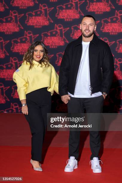 Ines Reg and Kevin Debonne attends the 22nd NRJ Music Awards on November 20, 2021 in Cannes, France.