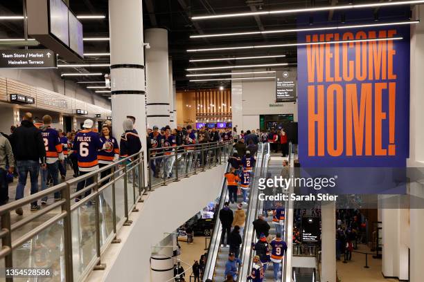 Fans on the concourse before the first period between the Calgary Flames and the New York Islanders at UBS Arena on November 20, 2021 in Elmont, New...