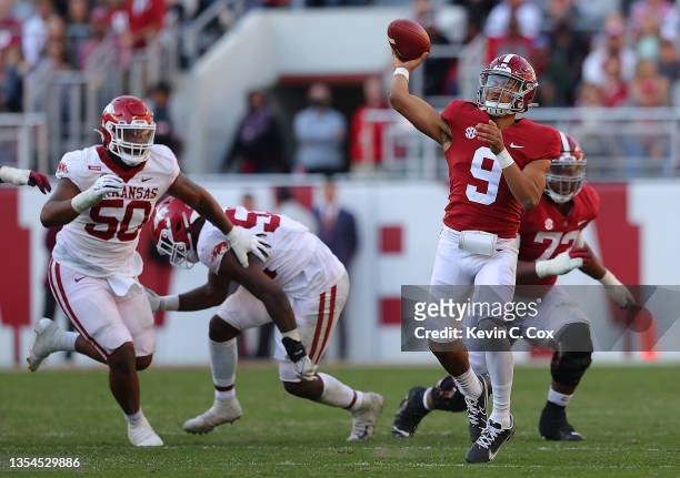 Bryce Young of the Alabama Crimson Tide passes against the Arkansas Razorbacks during the first half at Bryant-Denny Stadium on November 20, 2021 in...