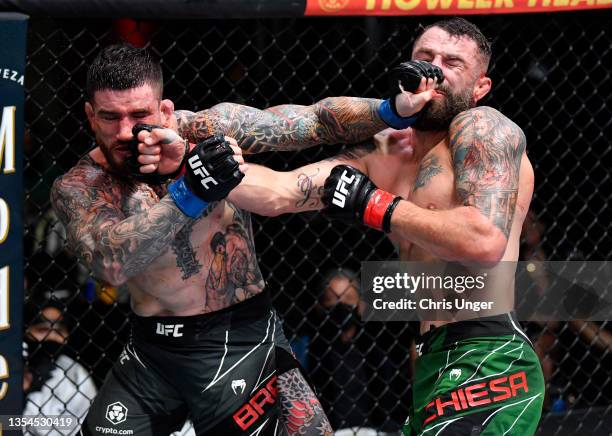 Sean Brady and Michael Chiesa trade punches in a welterweight fight during the UFC Fight Night event at UFC APEX on November 20, 2021 in Las Vegas,...