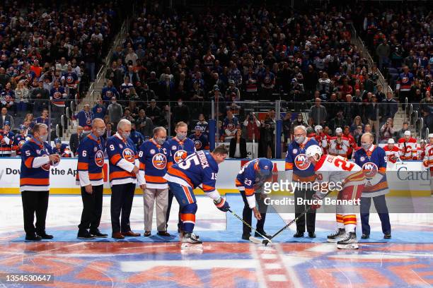 Bob Nystrom drops the ceremonial puck prior to the home opening game between the New York Islanders and the Calgary Flames at the UBS Arena on...