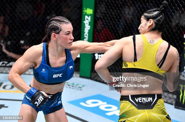 Miesha Tate punches Ketlen Vieira of Brazil in a bantamweight fight during the UFC Fight Night event at UFC APEX on November 20, 2021 in Las Vegas,...