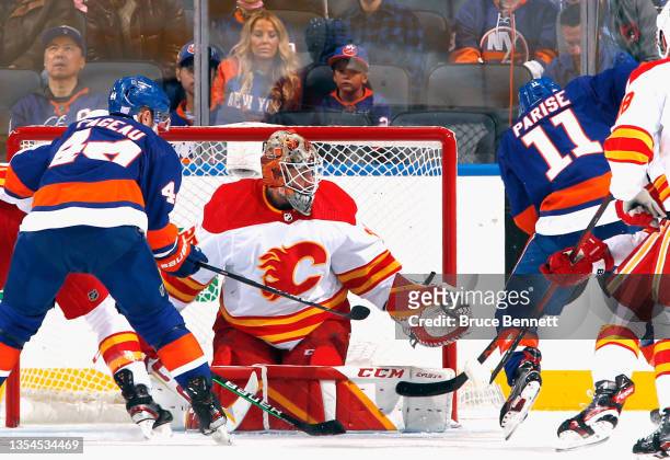 Jacob Markstrom of the Calgary Flames makes the first period save on Zach Parise of the New York Islanders at the UBS Arena on November 20, 2021 in...