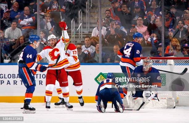 Andrew Mangiapane of the Calgary Flames celebrates his second period goal against the New York Islanders at the UBS Arena on November 20, 2021 in...