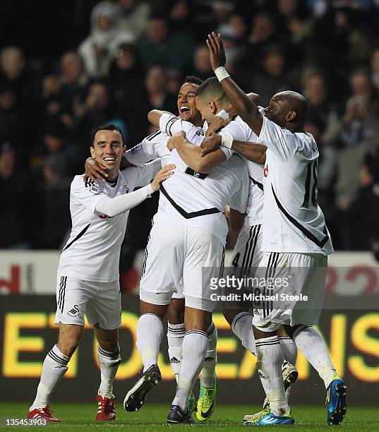 Scott Sinclair of Swansea City celebrates scoring his side first goal during the Barclays Premier League match between Swansea City and Fulham at the...
