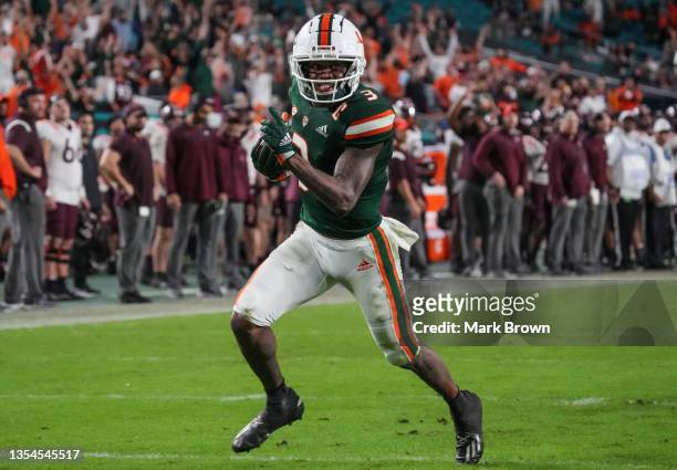 Mike Harley of the Miami Hurricanes runs for a touchdown reception against the Virginia Tech Hokies during the second half at Hard Rock Stadium on...