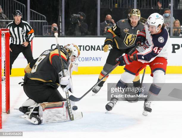 Alexandre Texier of the Columbus Blue Jackets scores a first-period short-handed goal against Laurent Brossoit and Mark Stone of the Vegas Golden...
