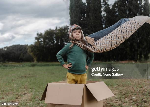 smiling little girl in a carton box - aviation hat stock pictures, royalty-free photos & images