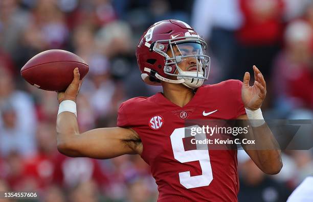 Bryce Young of the Alabama Crimson Tide looks to pass against the Arkansas Razorbacks during the first half at Bryant-Denny Stadium on November 20,...