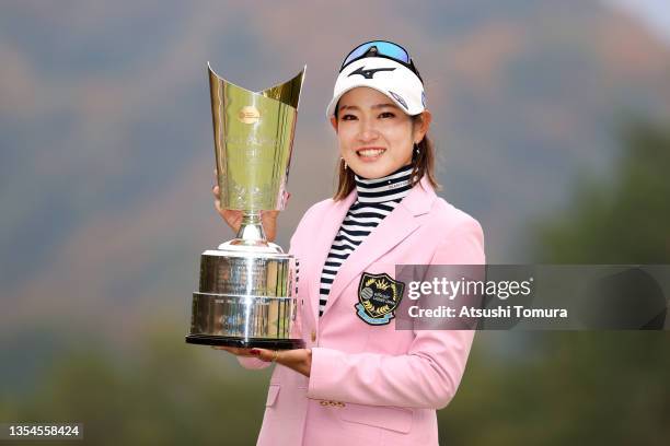 Erika Hara of Japan poses with the trophy after winning the tournament following the final round of the Daio Paper Elleair Ladies at the Elleair Golf...