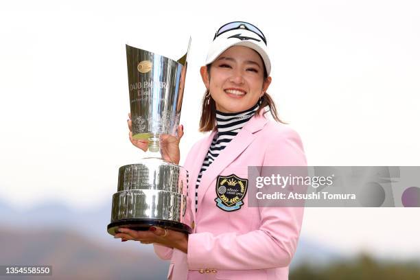 Erika Hara of Japan poses with the trophy after winning the tournament following the final round of the Daio Paper Elleair Ladies at the Elleair Golf...