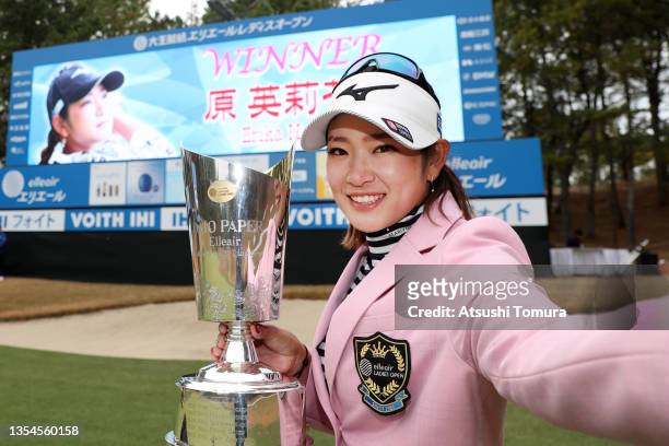 Erika Hara of Japan imitates a selfie after winning the tournament following the final round of the Daio Paper Elleair Ladies at the Elleair Golf...
