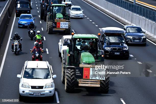 Farmers drive tractors on the southern motorway towards Auckland city during a protest against government regulations on November 21, 2021 in...