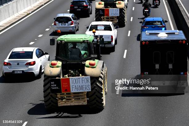 Farmers drive tractors on the southern motorway towards Auckland city during a protest against government regulations on November 21, 2021 in...