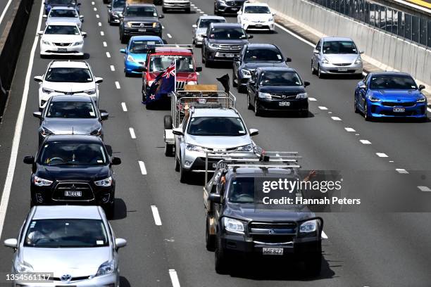 Farmers drive on the southern motorway towards Auckland city during a protest against government regulations on November 21, 2021 in Auckland, New...