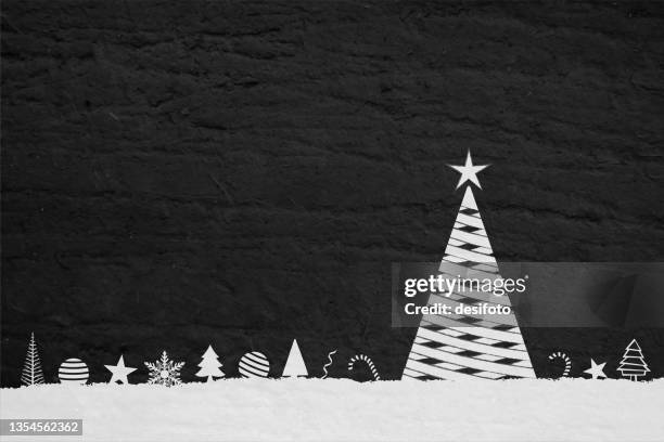 black and white coloured grunge effect textured vector grunge christmas backgrounds with one white tree made of crisscross mesh and several ornaments lined up like ball, bauble, candy cane, star over white snow - matte black texture stock illustrations
