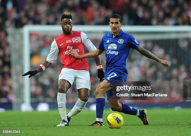 Alex Song of Arsenal tangles with Tim Cahill of Everton during the Barclays Premier League match between Arsenal and Everton at Emirates Stadium on...