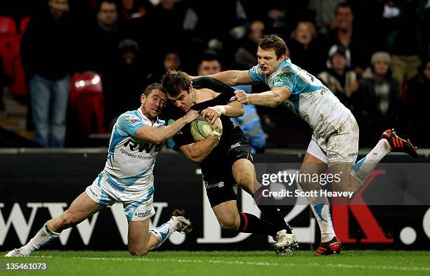 Chris Wyles of Saracens beats Shane Williams and Dan Biggar of Ospreys to score a try during the Heineken Cup Match between Saracens and Ospreys at...