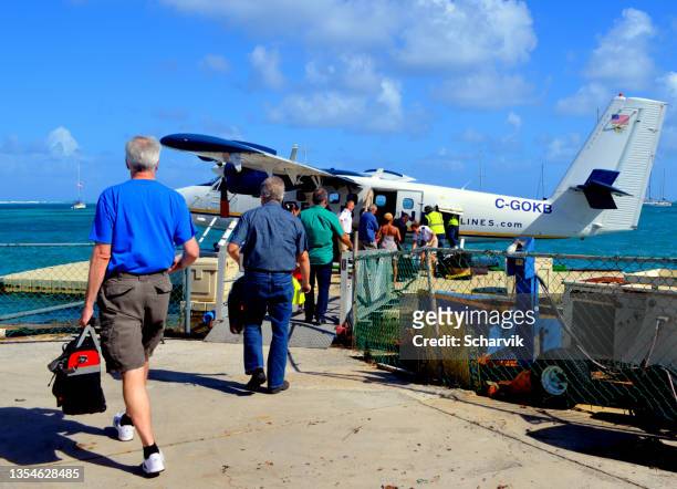 passengers boarding seaplane  st croix, us virgen islands - port wing wi stock pictures, royalty-free photos & images