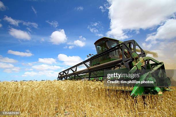 harvesting machine in field - combine oceania stock pictures, royalty-free photos & images