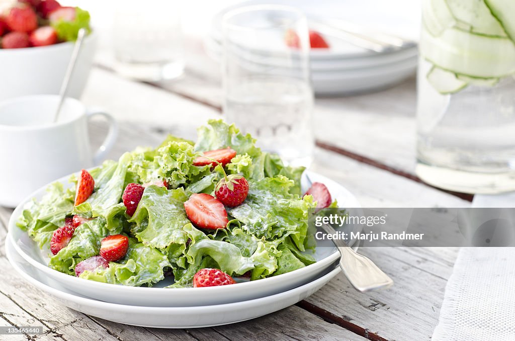 Green salad with strawberries