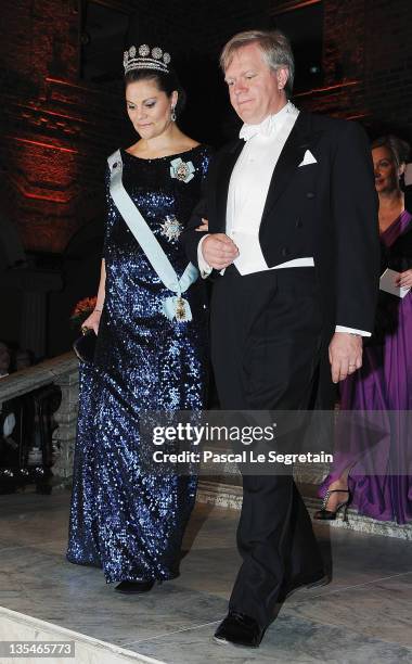 Crown Princess Victoria of Sweden and Australian Nobel Prize for Physics laureate Brian Schmidt arrive for the Nobel Prize Banquet at Stockholm City...