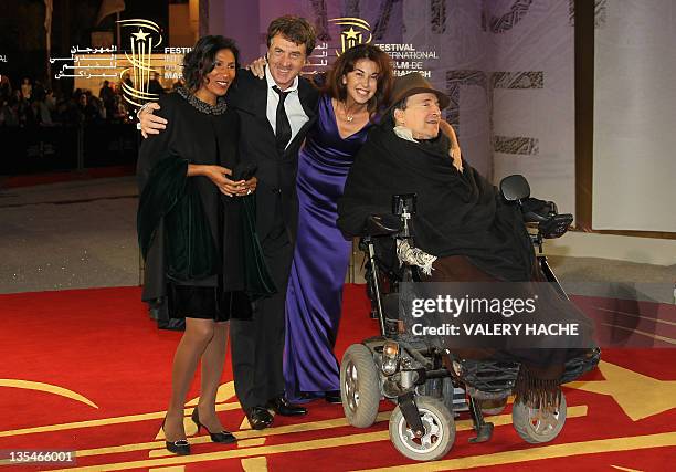 French actor Francois Cluzet and his wife Narjiss pose with French businessman Philippe Pozzo Di Borgo and his wife as they arrive at the 11th...