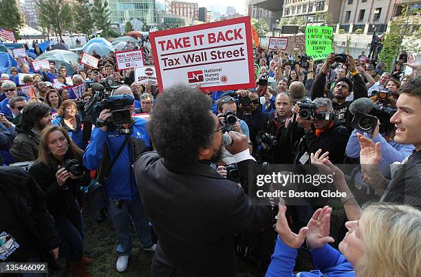 Princeton professor Cornel West and members of the MA Nurses Association, including President Donna Kelly-Williams, lower right, join Occupy Boston,...