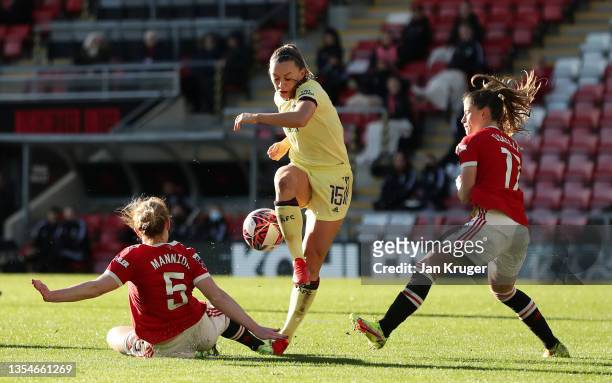 Aoife Mannion of Manchester United brings down Katie McCabe of Arsenal to concede a penalty during the Barclays FA Women's Super League match between...