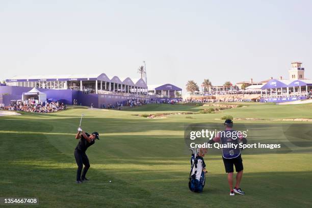 Collin Morikawa of United States plays a shot during Day Four of The DP World Tour Championship at Jumeirah Golf Estates on November 21, 2021 in...