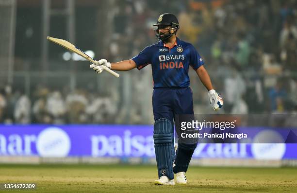 Rohit Sharma of India celebrates their half century during the Third T20 International match between India and New Zealand at Eden Gardens on...
