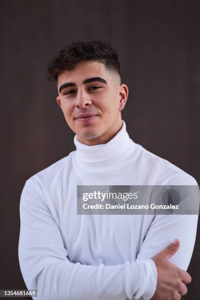 content ethnic man in studio - mock turtleneck stock-fotos und bilder