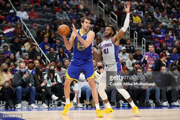 Nemanja Bjelica of the Golden State Warriors looks to pass the ball while being guarded by Saddiq Bey of the Detroit Pistons in the second half at...