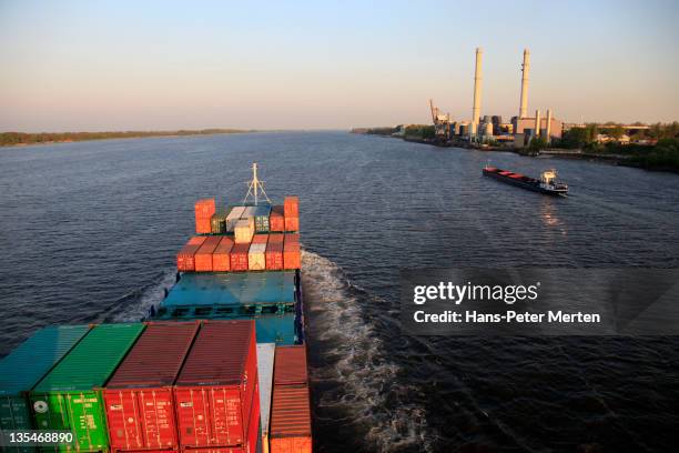 container vessel at river elbe near wedel - moving-past stock pictures, royalty-free photos & images