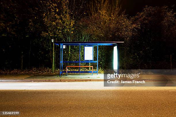 illumnated bus stop - bus stop uk stock pictures, royalty-free photos & images