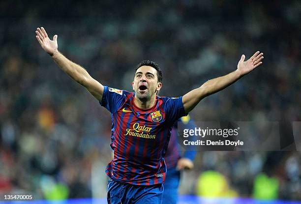 Xavi Hernandez of Barcelona celebrate after Barcelona scoring Barcelona's 2nd goal during the La Liga match between Real Madrid and Barcelona at...