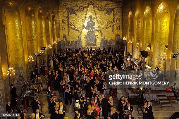 Guests of the Nobel banquet dance at the golden hall in the Stockholm City Hall, following the Nobel award ceremony on December 10, 2011. AFP PHOTO/...