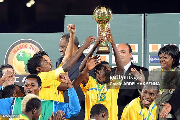 Gabonese football players celebrate with their trophy their victory on Morocco at the end of their CAF under-23 championship final football match...