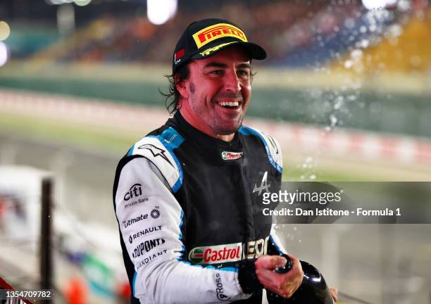Third placed Fernando Alonso of Spain and Alpine F1 Team celebrates on the podium during the F1 Grand Prix of Qatar at Losail International Circuit...